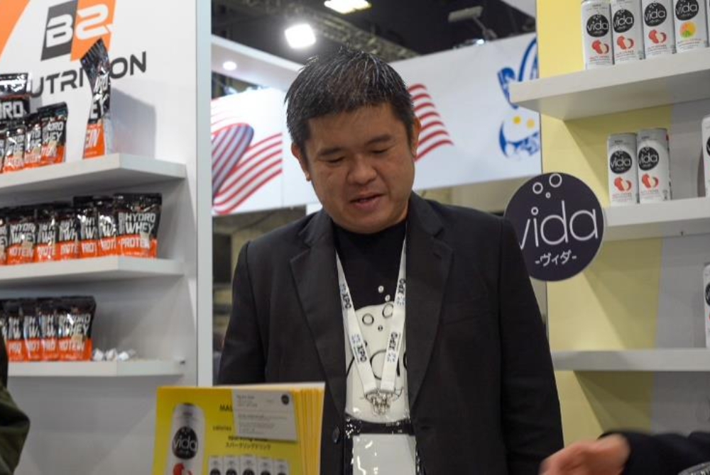 Entrepreneurs from Malaysia preparing product samples for tasting by visitors at The
Food Show.