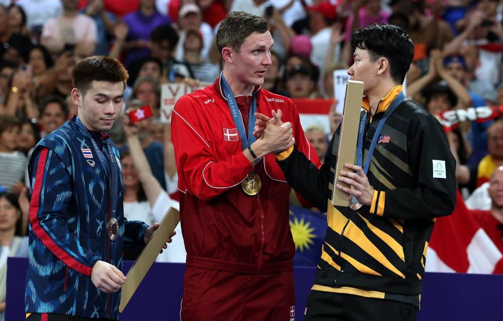 Malaysia's singles Lee Zii Jia receiving the bronze medal in the men's singles badminton event at the Paris 2024 Olympics at the Porte De La Chapelle Arena yesterday. - Photo by Bernama