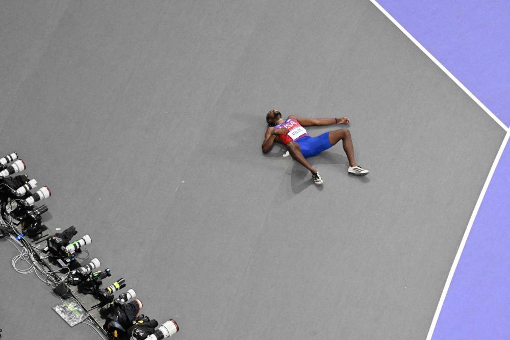 US' Noah Lyles reacts after competing in the men's 200m final of the athletics event at the Paris 2024 Olympic Games at Stade de France in Saint-Denis, north of Paris, on August 8, 2024. (Photo by AFP)