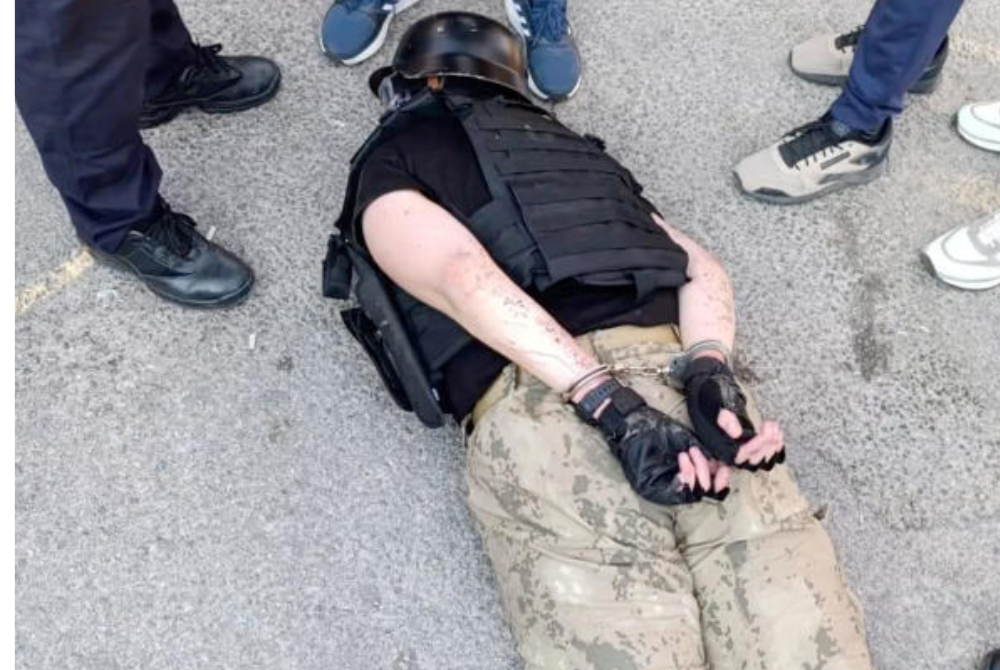 A suspect, whom Turkish Interior Minister Ali Yerlikaya's account on X named as AK and who, according to the account, attacked and injured 5 citizens, lies on the ground in handcuffs while being detained, in Eskisehir, Turkey. - Turkish Interior Minister via X