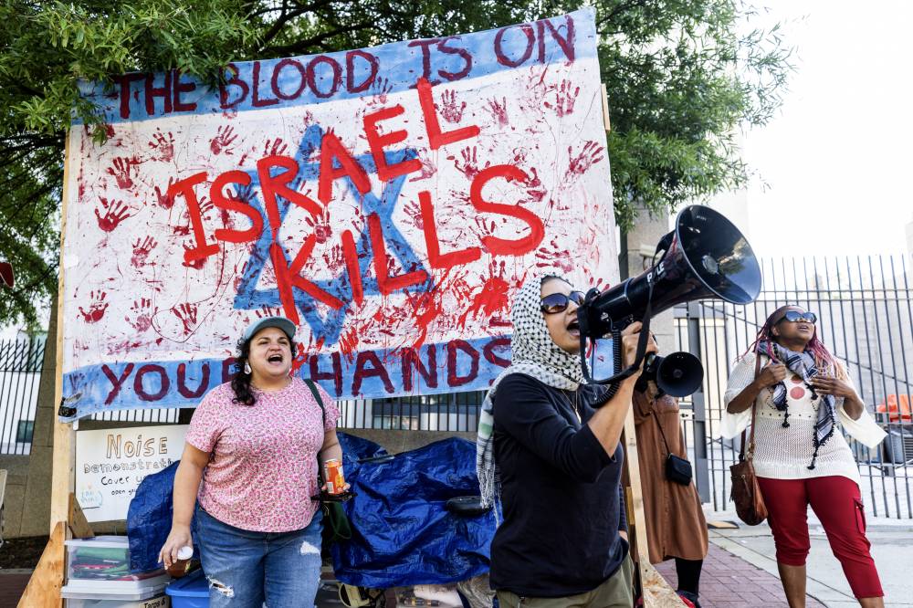 Pro-Palestinian protesters demonstrate against the Israel-Hamas conflict in Gaza, outside the Israeli embassy in Washington, DC, US, Aug 13, 2024. (Photo by EPA/JIM LO SCALZO)
