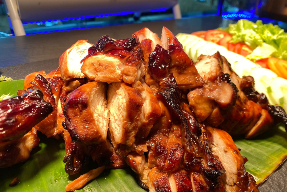 Succulent roasted chicken perfectly paired with its rice. 