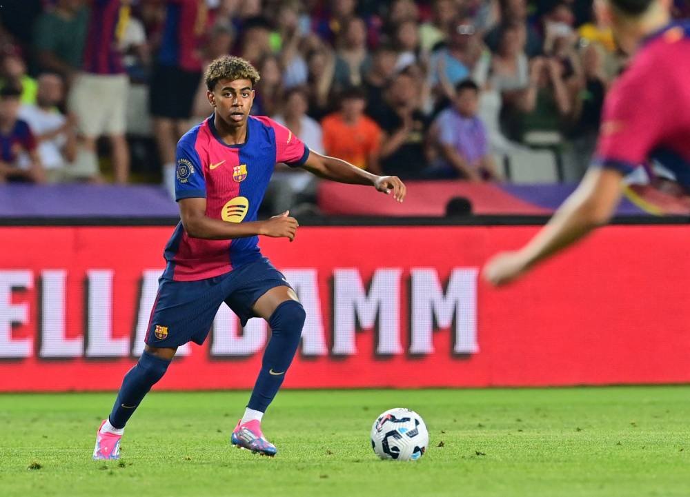 Barcelona's Spanish forward #19 Lamine Yamal prepares to kick the ball during the 59th Joan Gamper Trophy football match between FC Barcelona and AS Monaco at the Estadi Olimpic Lluis Companys in Barcelona on August 12, 2024. (Photo by AFP)