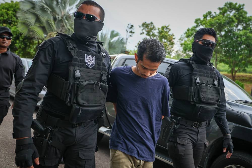 Mohd Fadzly Ariffadzilah was charged at the Magistrate’s Court here today with murdering Istiqomah Ahmad Rozi whose body was found in a bin by the roadside here in December last year. - Photo by Bernama
