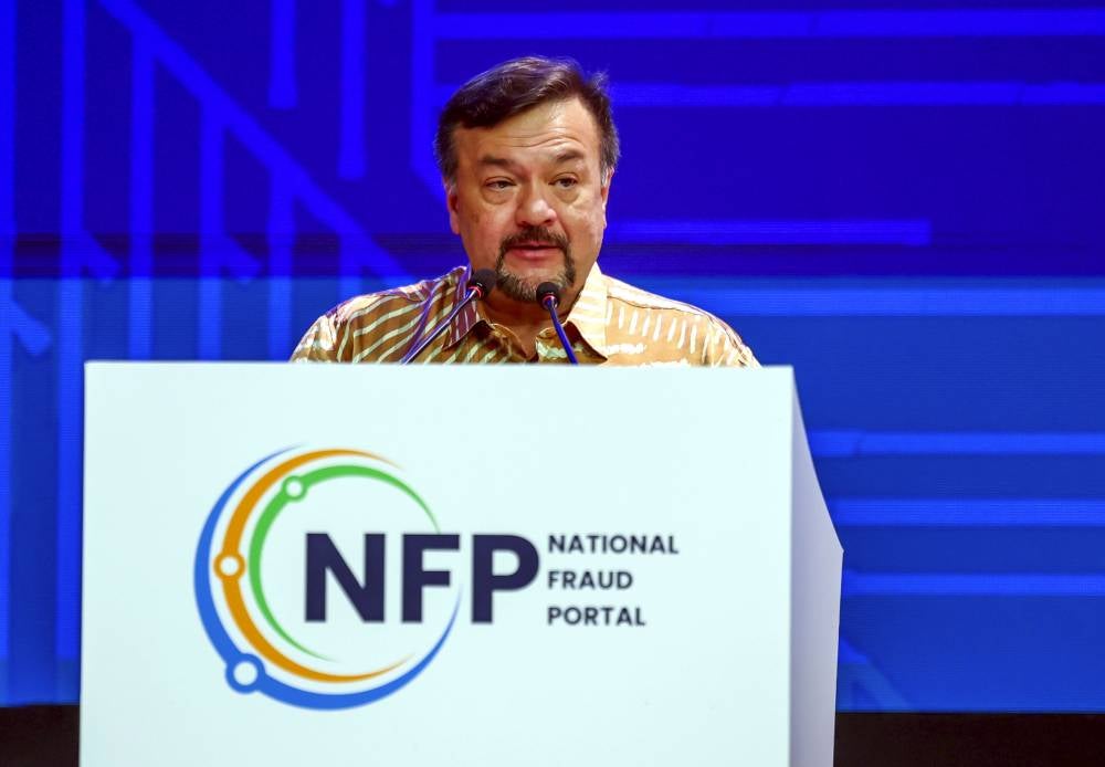 Second Finance Minister Amir Hamzah Azizan delivering his speech at the launching of the National Fraud Portal (NFP) at Sasana Kijang, Bank Negara Malaysia, today. - Photo by Bernama