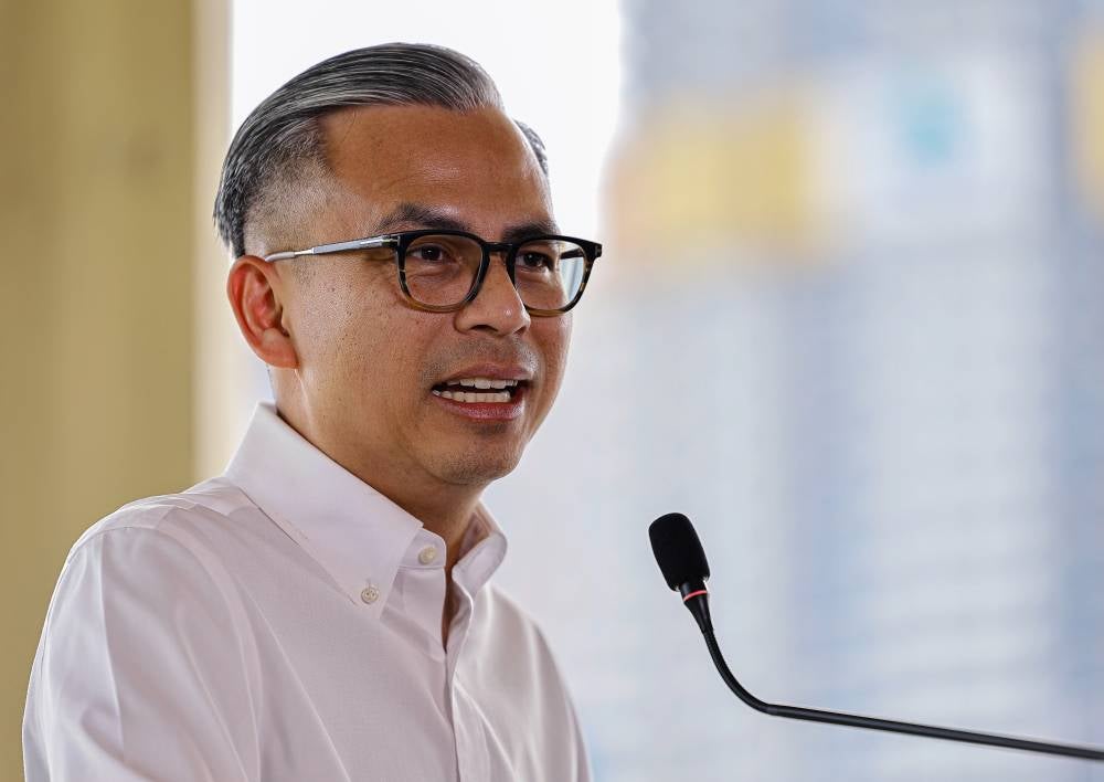 Communications Minister Fahmi Fadzil during the post-Cabinet meeting press conference today. - Photo by Bernama