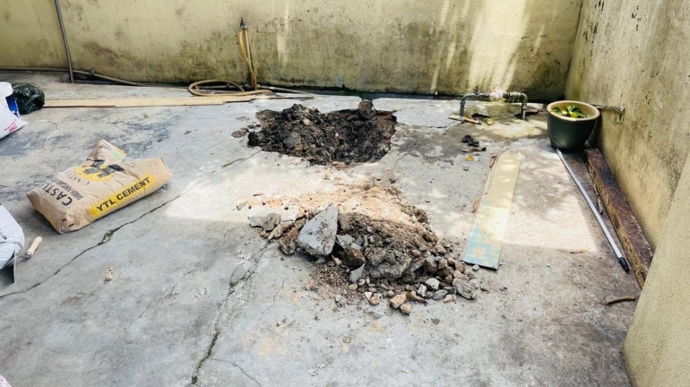 The body of an infant was found buried in the cement on a house porch at Taman Sri Rokam, Jalan Pasar. 