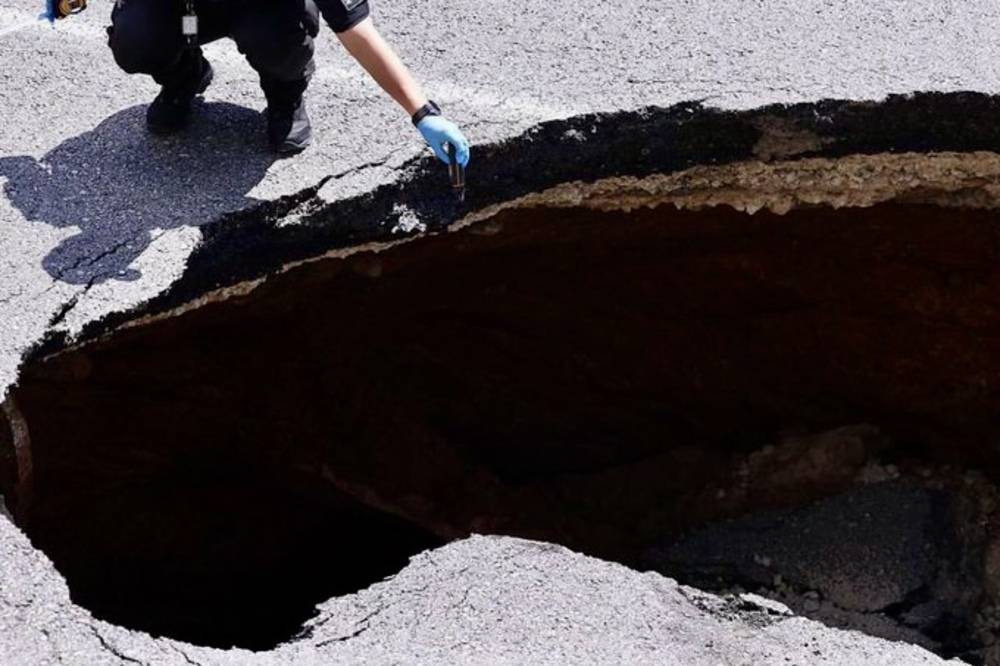 The sinkhole is reported to be measured at 6 metres wide and 4 metres long. Photo source: X.