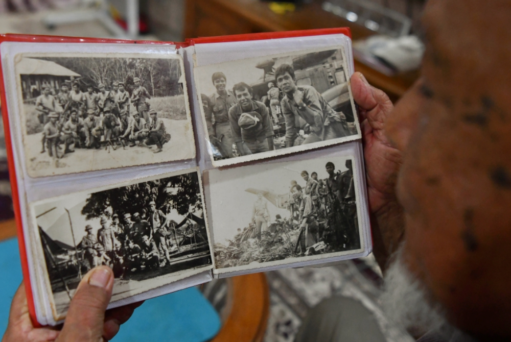 Zawawi said each picture tells countless stories of joy and sorrow experienced with his friends during operations when the country faced the threat of the Malayan Communist Party. - Photo by Bernama