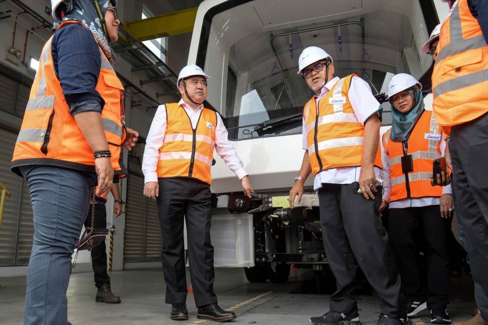 Transport Minister Anthony Loke (two, left) during a work visit on the development of the automated people mover system (Aerotrain) at KL International Airport (KLIA). - Photo by Bernama