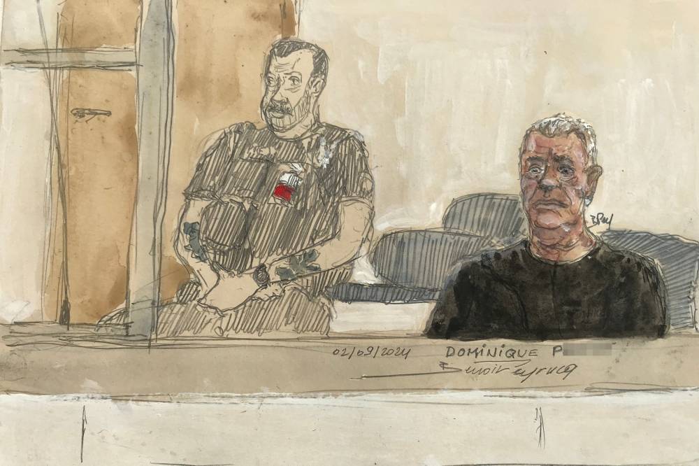 This court sketch made on September 2, 2024 shows defendant Dominique P. (R) during his trial in which he is accused of drugging his wife for nearly ten years and inviting strangers to rape her at their home in Mazan, a small town in the south of France, at the courthousein Avignon. - Photo by AFP