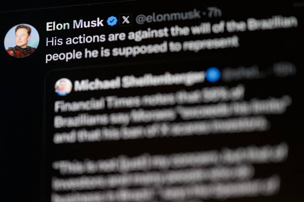 This photo illustration shows a screen displaying a post from Elon Musk's social media account X (formerly Twitter) in Rio de Janeiro, Brazil, on Sept 2, 2024. - (Photo by MAURO PIMENTEL / AFP)
