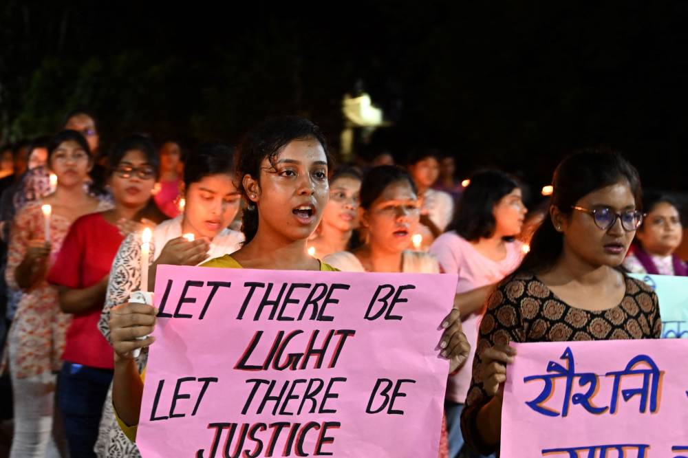 Health professionals along with nursing students take part in a demonstration to condemn the rape and murder of a doctor, at the RG Kar Medical College and Hospital in Kolkata on September 4, 2024. - Photo by AFP