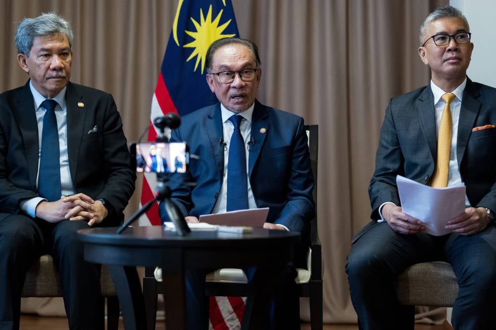 Prime Minister Datuk Seri Anwar Ibrahim (centre) during a press conference during a two-day working visit in conjunction with the 9th Eastern Economic Forum at Far Eastern Federal University campus in Vladivostok, Russia, today. Also present Minister of Investment Trade and Industry Tengku Datuk Seri Zafrul Tengku Abdul Aziz (right) and Foreign Minister Datuk Seri Mohamad Hasan. - Photo by Bernama