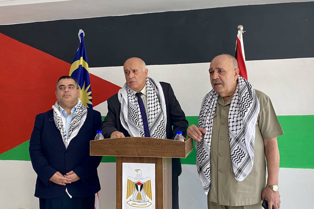 Palestinian Sports Minister Jibril Rajoub (centre) speaking at a press conference at the Embassy of the State of Palestine in Kuala Lumpur earlier today, accompanied by Palestine's Ambassador to Malaysia, Walid Abu Ali (right).