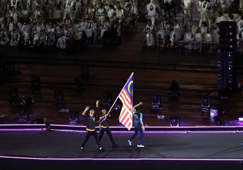 The Jalur Gemilang proudly flying during the official closing ceremony of the Paris 2024 Paralympic Games at the Stade de France. - Photo by Bernama