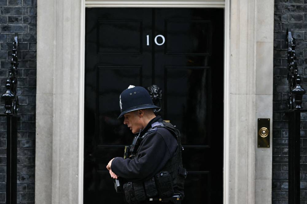 A police officer patrols in front of the entrance door at 10 Downing Street, in central London, on September 11, 2024. (Photo by AFP)