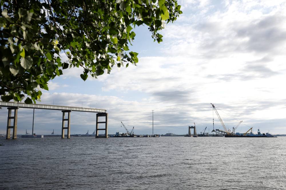 Salvage crews continue to clean up wreckage from the collapse of the Francis Scott Key Bridge in the Patapsco River on June 11, 2024 in Baltimore, Maryland. - (Photo by Kevin Dietsch / AFP)
