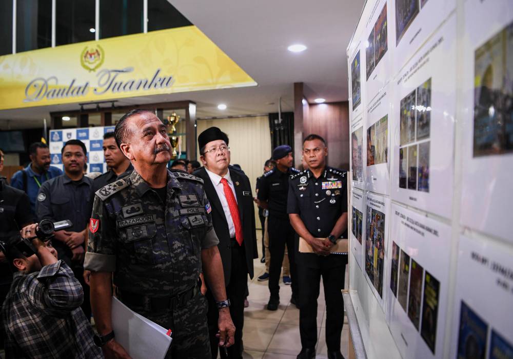 Razarudin said 38 vehicles, estimated to be worth RM3.94 million, and 14 plots of land, the value of which is still under investigation, were also seized. - Photo by Bernama