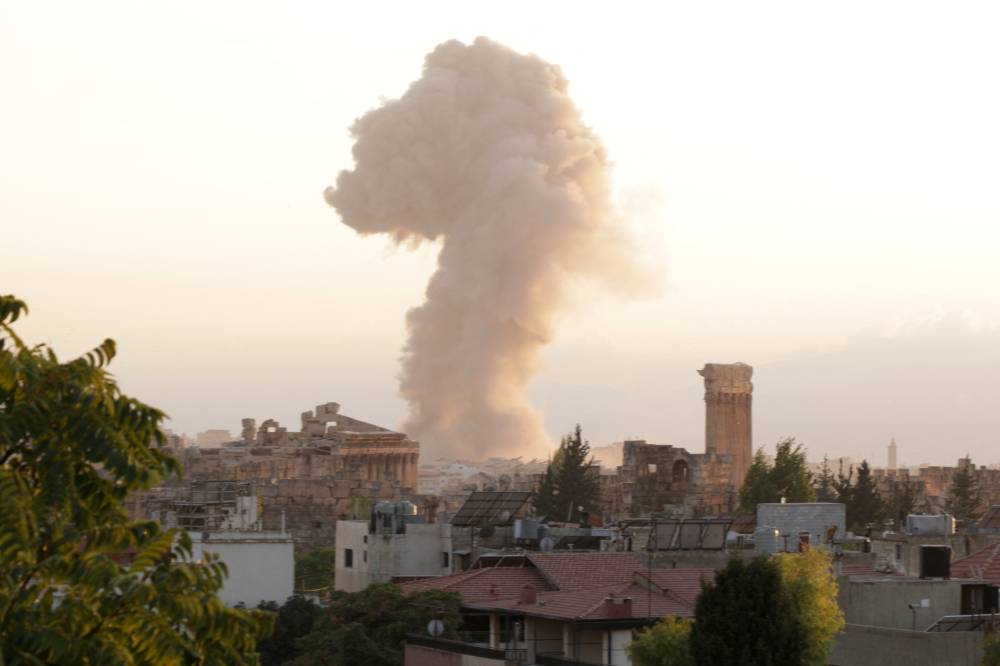 Smoke billows from the site of an Israeli airstrike on the Lebanese city of Baalbeck in the Bekaa valley on Sept 23, 2024. - (Photo by NIDAL SOLH / AFP)