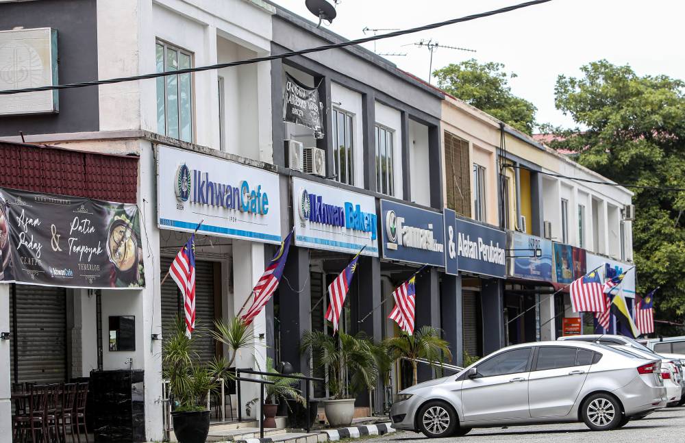 A few premises under Global Ikhwan Services and Business Holdings (GISBH) in Jalan Rapat Bistari 1 Taman Rapat that have been shut down. - Photo by Bernama