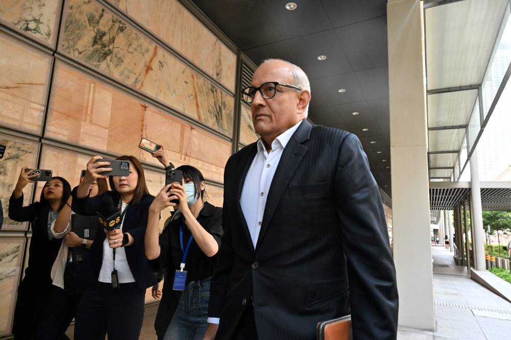 Singapore's former Minister for Transport and Minister-in-charge for Trade Relations S. Iswaran arrives at the Supreme Court in Singapore on Sept 24, 2024. - (Photo by ROSLAN RAHMAN / AFP)