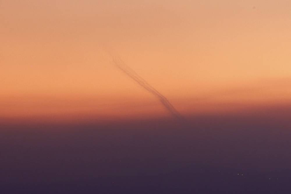 Rockets fired from southern Lebanon are intercepted by Israel's Iron Dome air defence system over northern Israel on September 23, 2024.- Photo by AFP