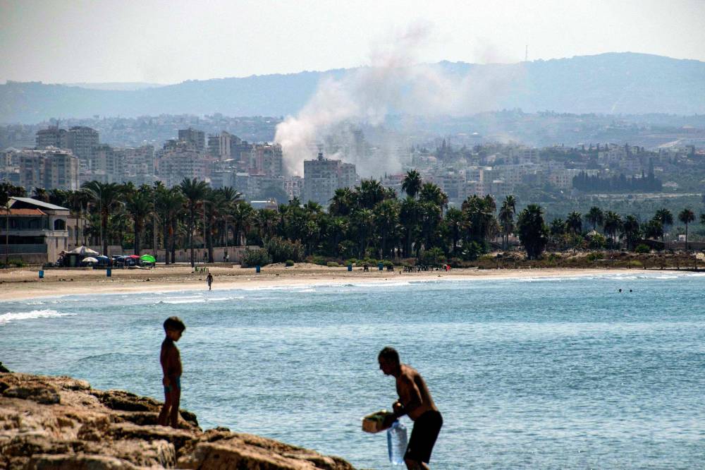 A cloud of smoke erupts during Israeli air strikes on a village south of Tyre in southern Lebanon on September 25, 2024. - Photo by AFP