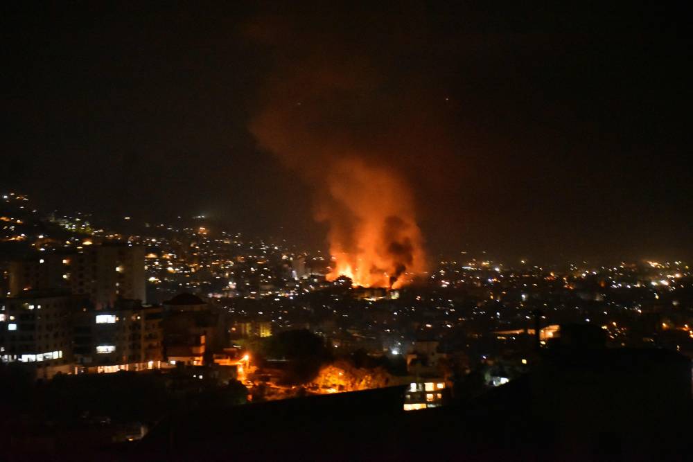 Smoke billows from the site of an Israeli airstrike that targeted a neighborhood in Beirut. Photo by Fadel Itani/AFP