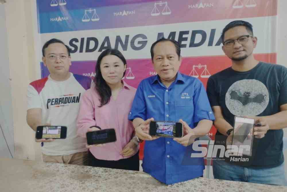 Ahmad (centre) at the press conference at the unity government operations centre for the Mahkota state by-election on Saturday.