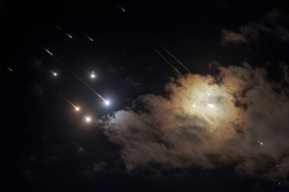 Projectiles being intercepted by Israel above Jerusalem on Oct 1. Photo by Menahem Kahana/AFP