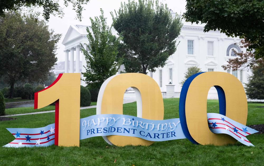 A sign on the North Lawn of the White House wishes a 'Happy Birthday' to former US President Jimmy Carter as he turns 100 years old. Photo by Sal Loeb/AFP
