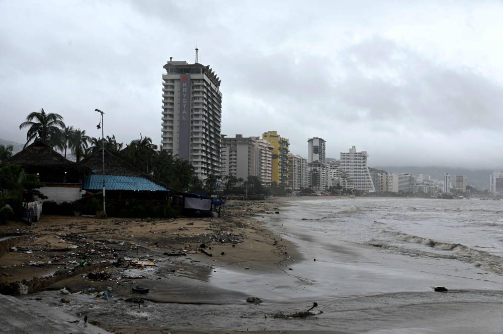 Garbage is pictured on the empty Santa Lucia Bay beach after the pass of Hurricane John in Acapulco, Mexico on September 26, 2024. - Photo by AFP