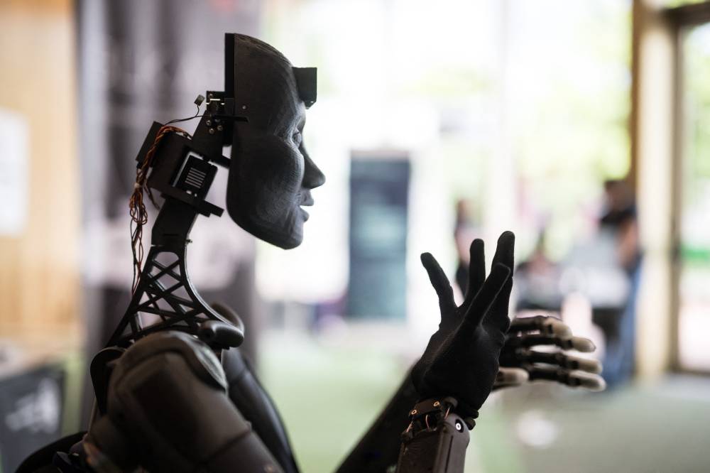A robot using artificial intelligence is displayed at a stand during the International Telecommunication Union (ITU) AI for Good Global Summit in Geneva, on May 30, 2024. - (Photo by Fabrice COFFRINI / AFP)