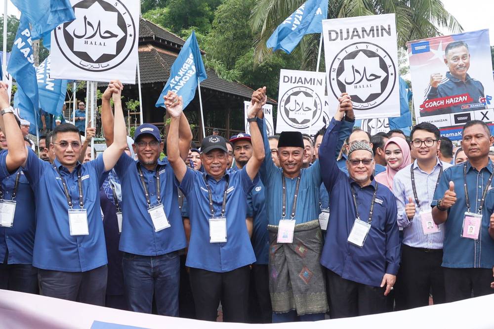 Perikatan Nasional chairman Tan Sri Muhyiddin Yassin (third from left) during recent Mahkota by-election candidate nomination day. Bernama FILE PIX