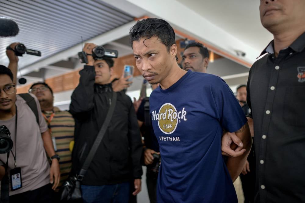 Mohd Syahid Hanapiah, 35, was charged with abusing a six-year-old boy entrusted to his care by caning him, an act that could have caused injury. Photo by Bernama
