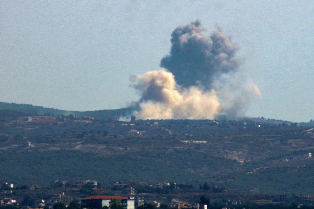 This picture taken from the southern Lebanese city of Tyre shows smoke rising from the site of an Israeli airstrike that targeted the village of Zibqin on Oct 4, 2024. - (Photo by KAWNAT HAJU / AFP)