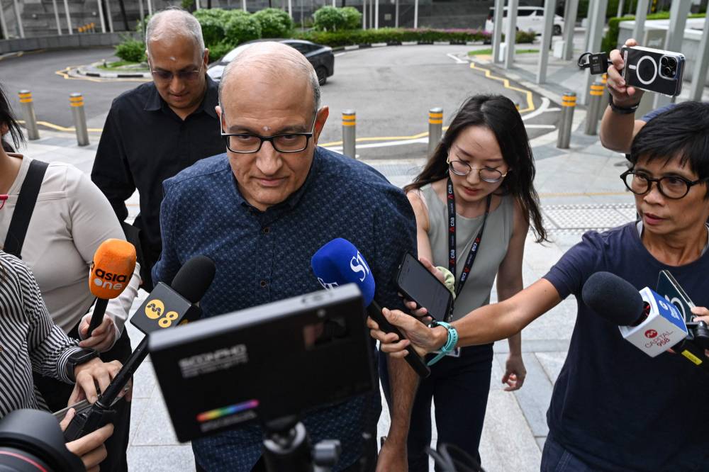 Singapore's former Minister for Transport and Minister-in-charge for Trade Relations S. Iswaran arrives at the State Court for the start of his 12-month jail sentence in Singapore on October 7, 2024. (Photo by AFP)
