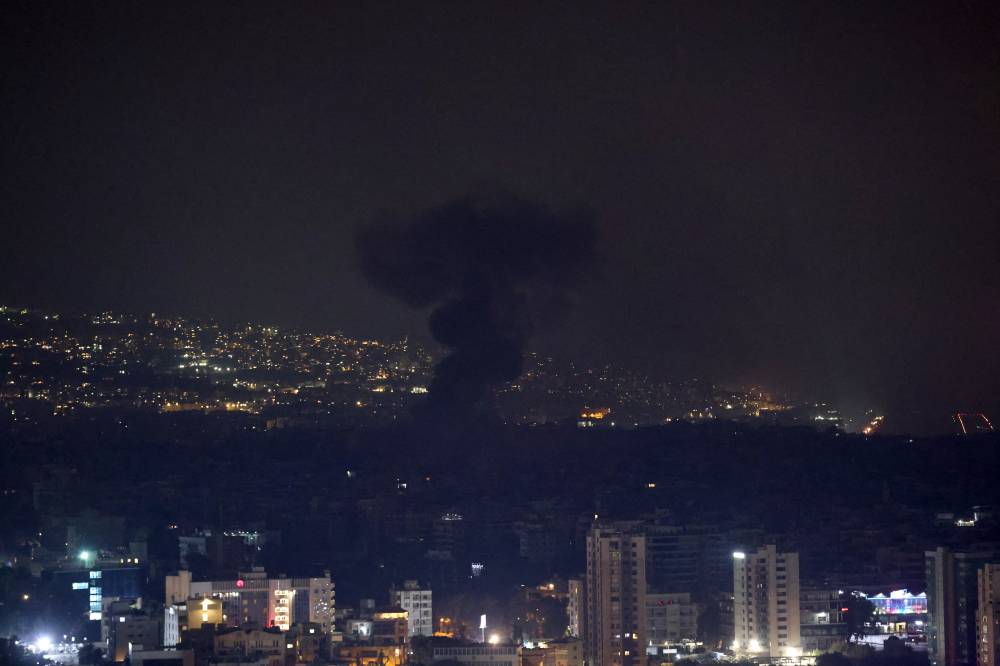 Smoke rises from the site of an Israeli airstrike that targeted a neighborhood in Beirut’s southern suburbs on Oct 7, 2024. - (Photo by Anwar Amro / AFP)