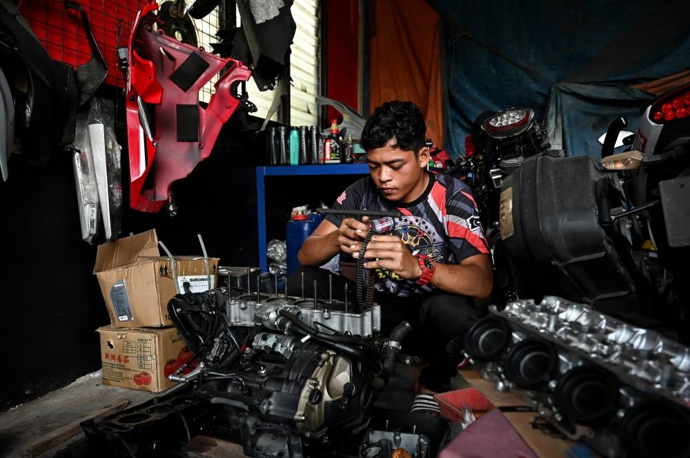 Syukur, who was nicknamed Malaysia's Mowgli, began to dabble in the automotive field by running a motorcycle workshop in Kampung Banggol Katong, here. Photo by Bernama