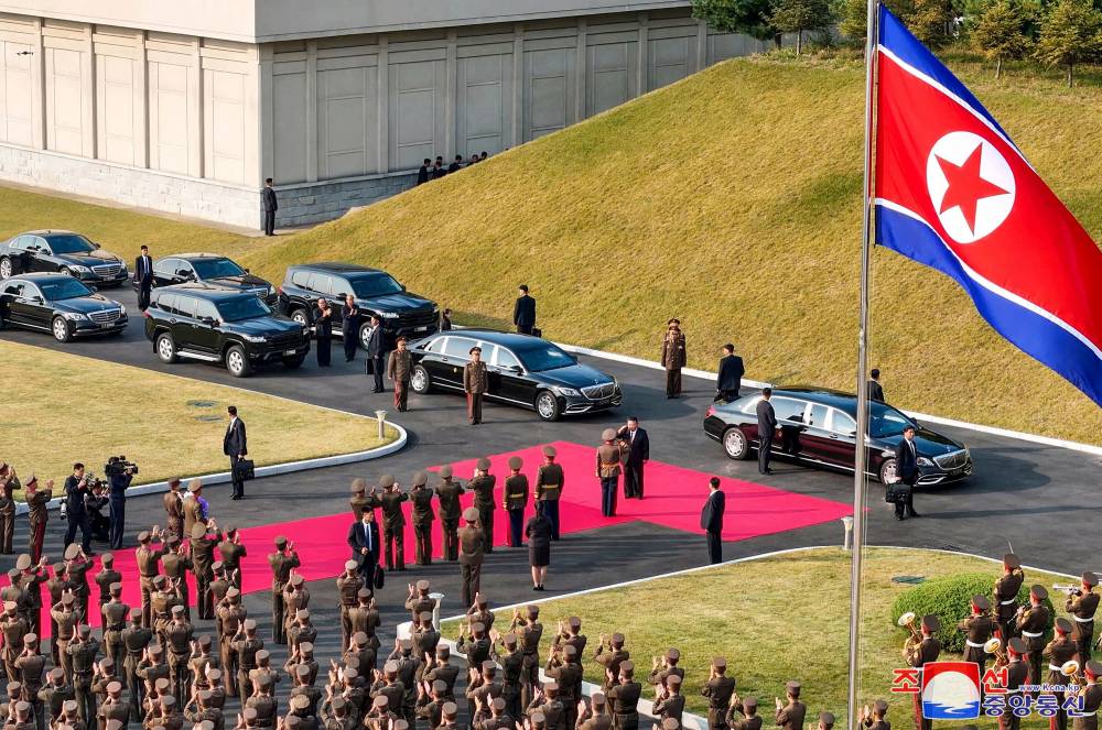 This picture taken on October 7, 2024 and released from North Korea's official Korean Central News Agency (KCNA) via KNS on October 8, 2024 shows North Korean leader Kim Jong Un (C) visiting Kim Jong Un University of National Defence for its 60th founding anniversary in Pyongyang. (Photo by KCNA VIA KNS / AFP)