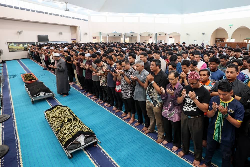 Bodies of the three victims were taken to the UiTM Dungun Mosque for prayers at around 10.10am, today. - Photo by Bernama