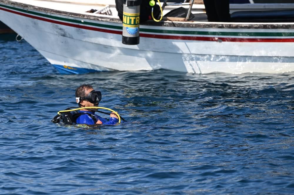 Sultan of Terengganu Sultan Mizan Zainal Abidin today graciously made a 17-metre (M) dive to place an inauguration plaque on an existing artificial reef in the waters off Alur Tuman. - Photo by Bernama