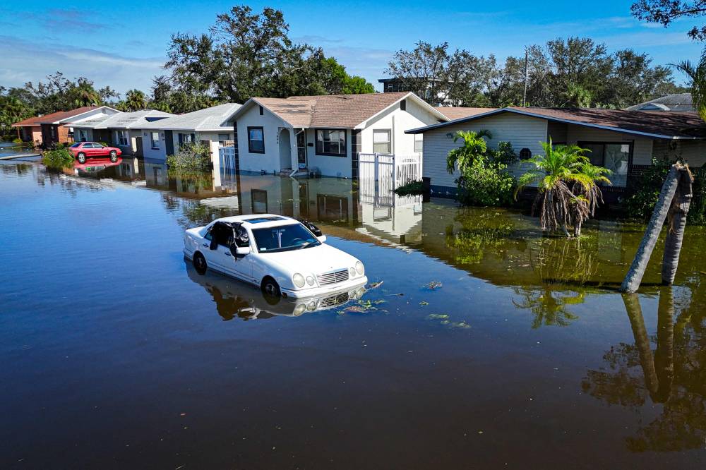 Neighborhoods are inundated in the aftermath of Hurricane Milton in Lake Maggiore, Florida, on October 10, 2024. (Photo by Miguel J. Rodriguez Carrillo / AFP)