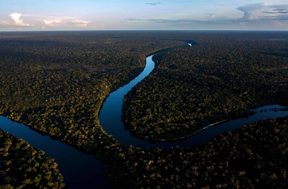 A drone view of the Manicore river, deep inside the Amazonia rainforest, Amazonas state, Brazil, on June 7, 2022. (Photo by MAURO PIMENTEL / AFP)