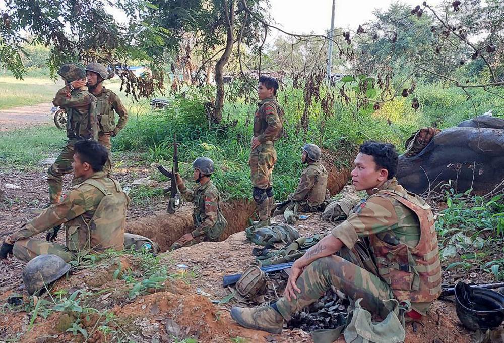 Members of the Ta'ang National Liberation Army (TNLA) gather inside a captured Myanmar military base in Hsipaw on October 15, 2024. (Photo by AFP)