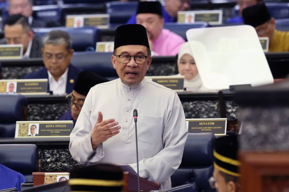 Prime Minister Datuk Seri Anwar Ibrahim presenting the 2025 Budget in the Dewan Rakyat on Friday. Photo by Bernama.