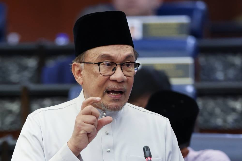 Prime Minister Datuk Seri Anwar Ibrahim presenting the 2025 Budget in the Dewan Rakyat on Friday. Photo by Bernama.