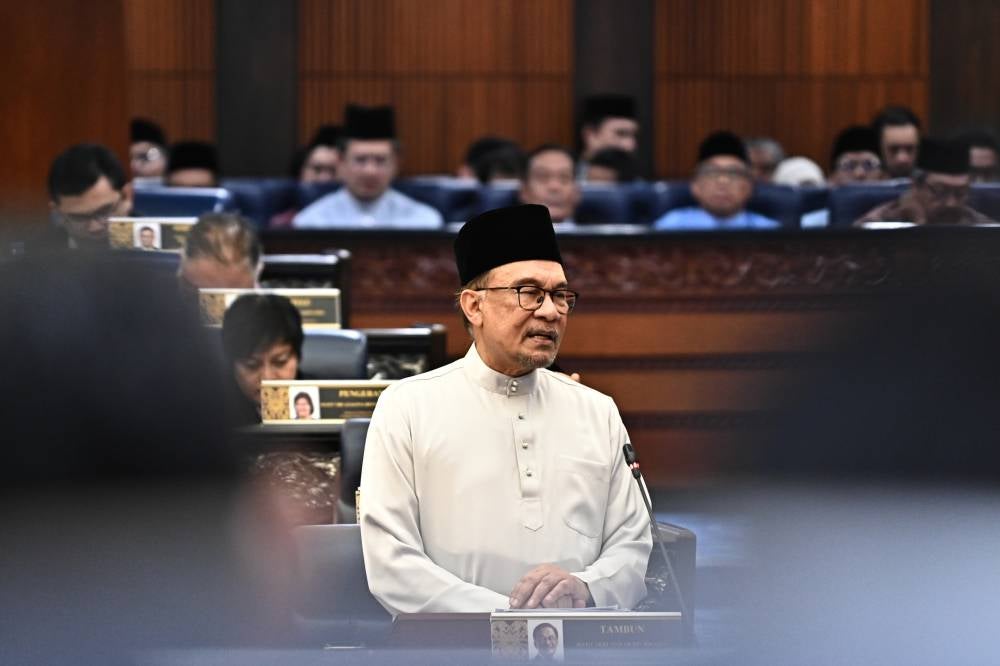 Anwar tabling the Budget 2025 in the Dewan Rakyat on Friday.