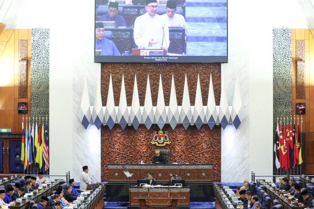 Finance Minister Datuk Seri Anwar Ibrahim announced an allocation of RM2 billion for upgrading and maintaining schools nationwide when presenting Budget 2025 in the Dewan Rakyat today. - Photo by Bernama
